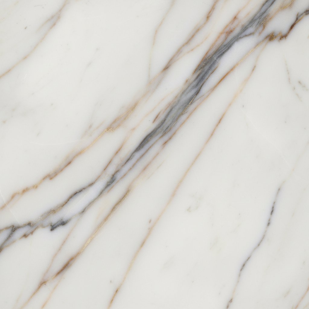 Polished Calacatta Gold marble slab showing bold gold veining over white field